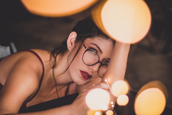 close-up-of-a-woman-in-black-tank-top-with-eyeglasses-3179275-2