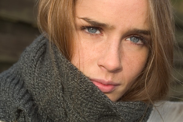 close-up-photo-of-a-brown-haired-woman-wearing-a-grey-scarf-2487985