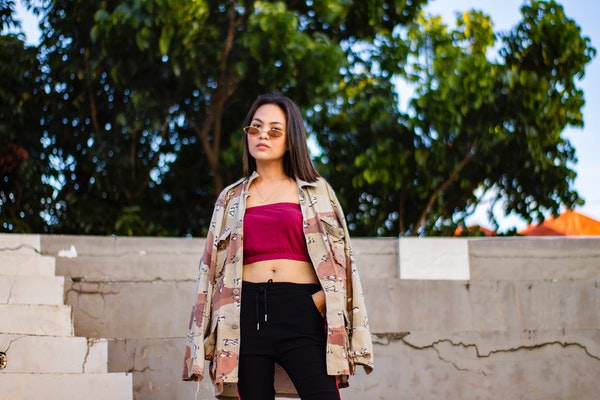 woman-standing-while-wearing-sunglasses-3670382